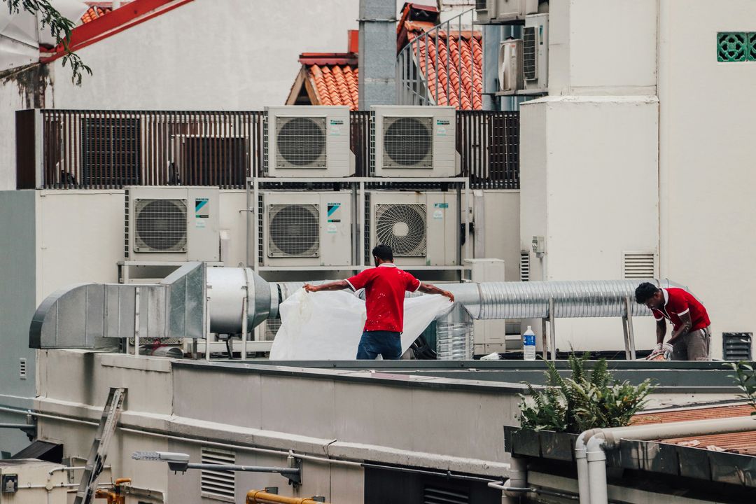 HVAC technicians inspecting rooftop units in Charleston SC